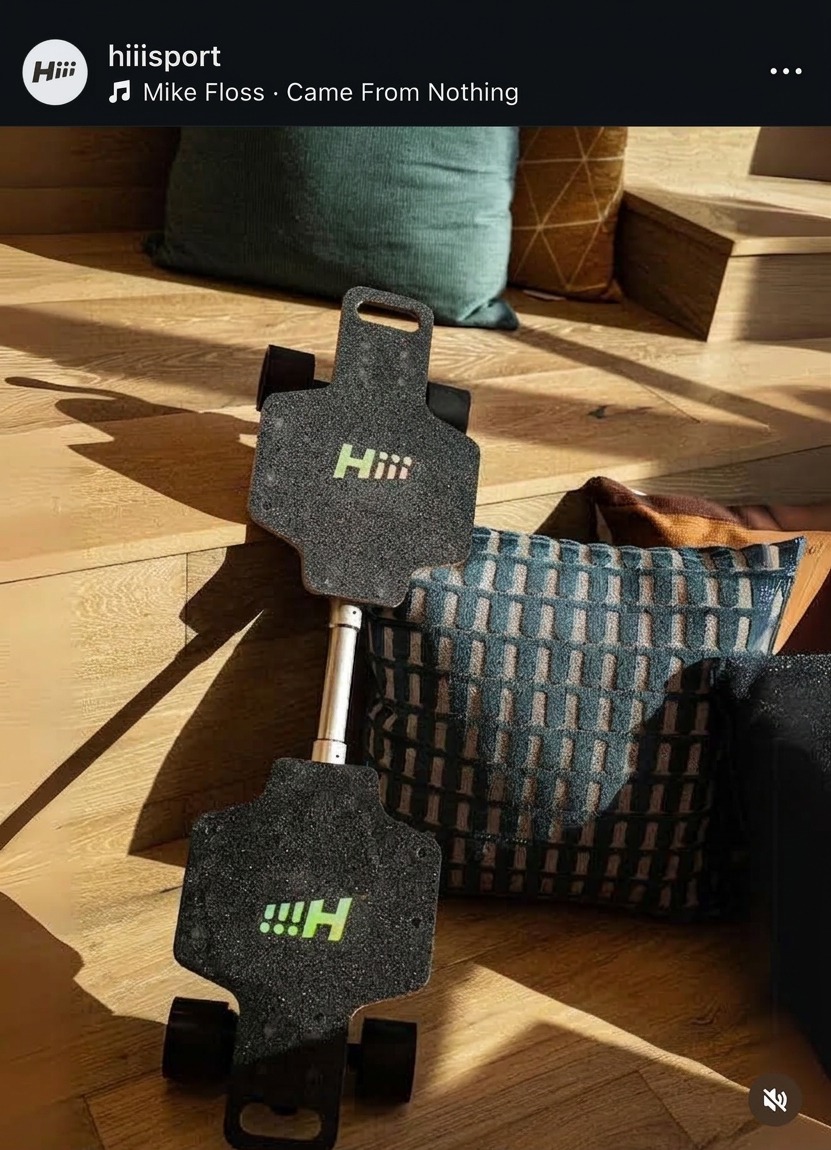 Instagram post from HIII's own account showing the Hiii electric skateboard trucks and motor assembly on a wood floor.